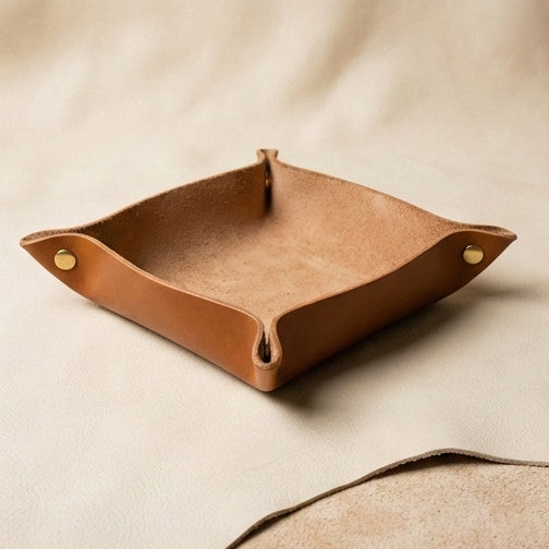 Leather valet tray with coins and cufflinks