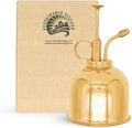 Brass mister with plants
