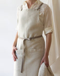 Linen cross-back apron worn front view