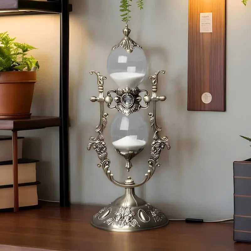 Hourglass sand timer on a shelf beside a plant